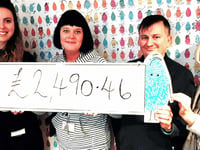 Proud Jackfest team presents cheque to children's hospice