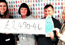 Proud Jackfest team presents cheque to children's hospice