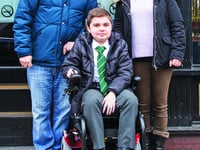 Gaming centre presents Woking teenager with powered wheelchair