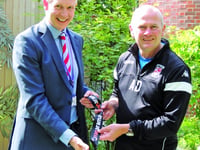 Dowson donates medal in aid of hospice auction