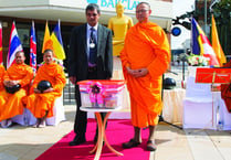 Woking temple monks host alms-giving ceremony
