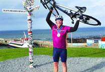 Cyclist completes epic bike ride for Woking and Sam Beare hospices