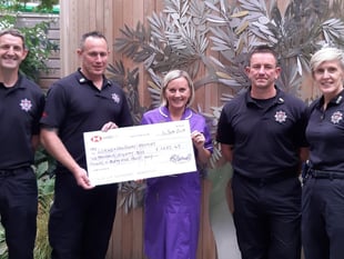 Firefighters present £1000 cheque to hospice