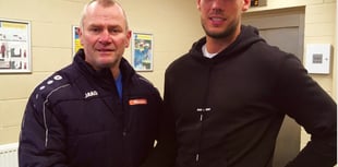 Cards snap up striker