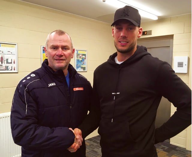 Cards snap up striker