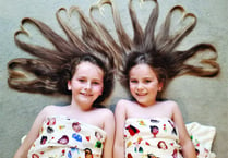 Sisters give hair-raising donation to children's charity