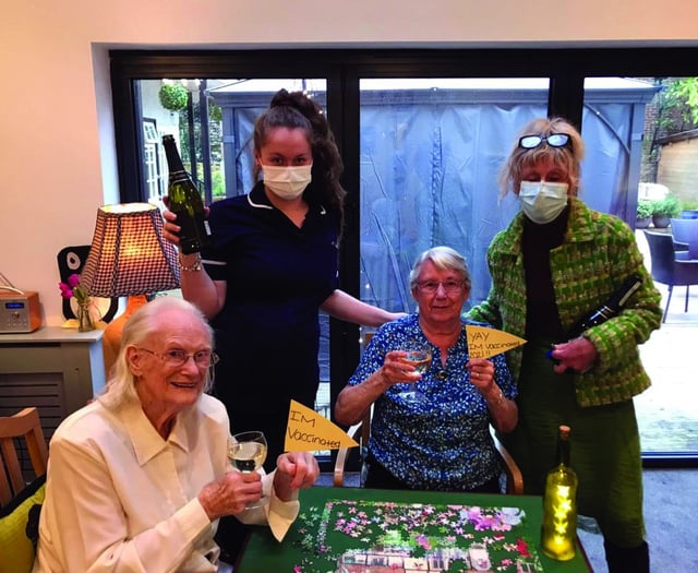 Care home residents celebrate jabs with a party
