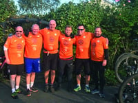 Woking FC players and staff hit the saddle for charity