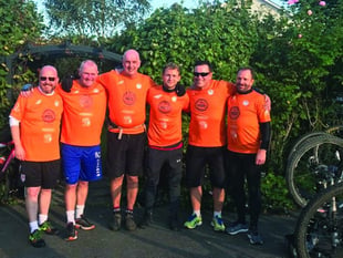 Woking FC players and staff hit the saddle for charity