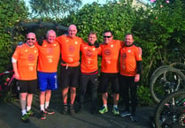 Woking FC players and staff hit the saddle for charity