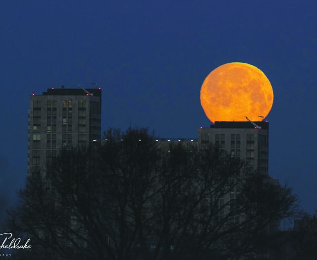 Wolf moon over town centre