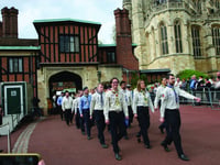 Scouts march into castle to receive their royal awards