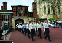 Scouts march into castle to receive their royal awards