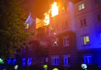 Evacuation as fire grips flats