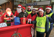 Woking Mayor helps with bucket collection for charity