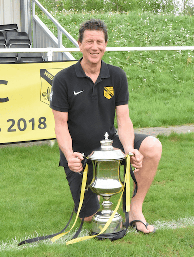 Steve Perkins with the Combined Counties League championship trophy, won by Westfield in 2018.