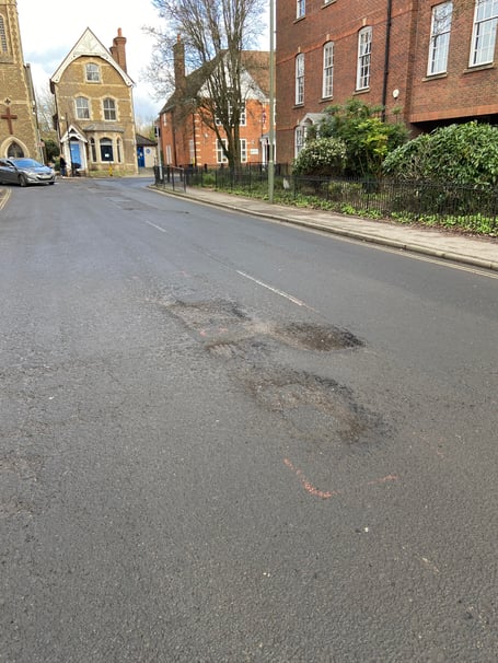 Surrey County Council says highways engineers are aware of the worsening condition of the road in South Street, Farnham