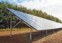 Plans for field of solar panels to power farm office and cottage