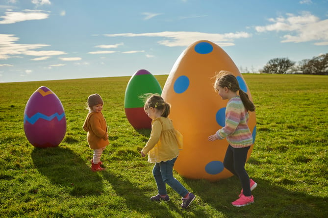 Children enjoying the giant Easter eggs.