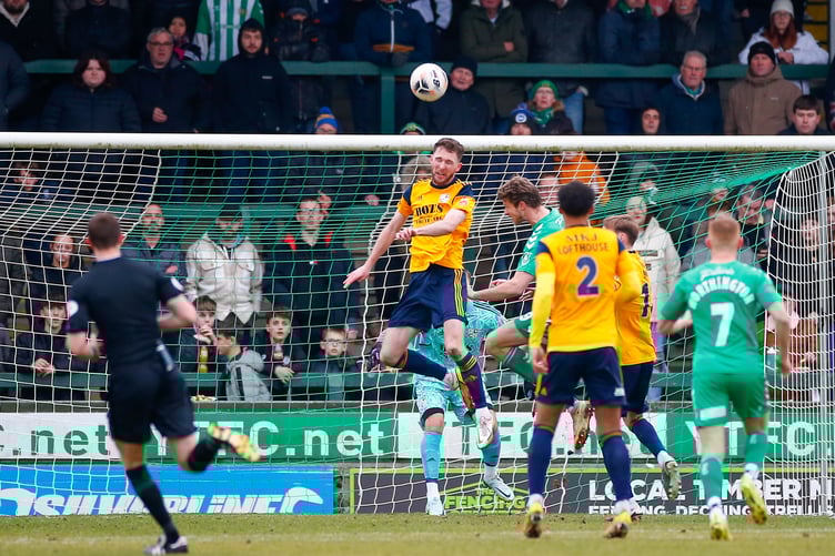 Jim Kellermann defends for Woking against Yeovil Town.