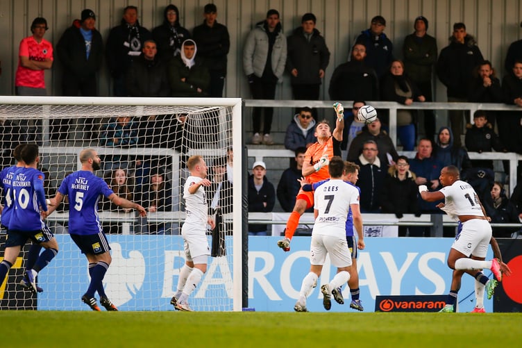 Craig Ross punches clear for the Cards.