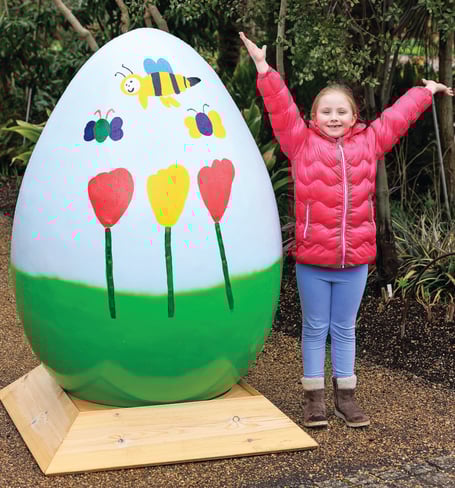 Winners and family members pictured with their Easter egg designs at the start of the Easter Egg Hunt and RHS Garden Wisley.