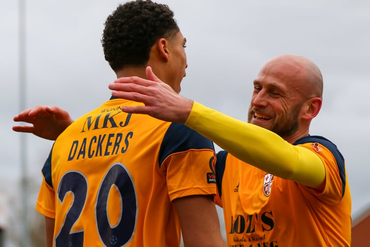 Scott Cuthbert celebrates a Woking goal with Marcus Dackers.