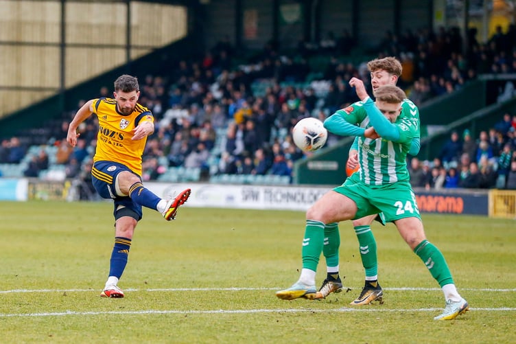 Woking's Pádraig Amond goes for goal.
