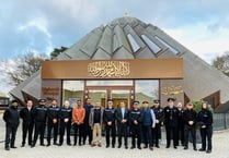 Police officers and firefighters show support for Muslim colleagues