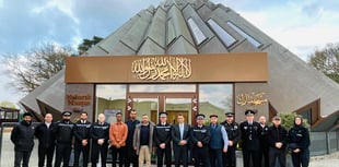 Police officers and firefighters show support for Muslim colleagues