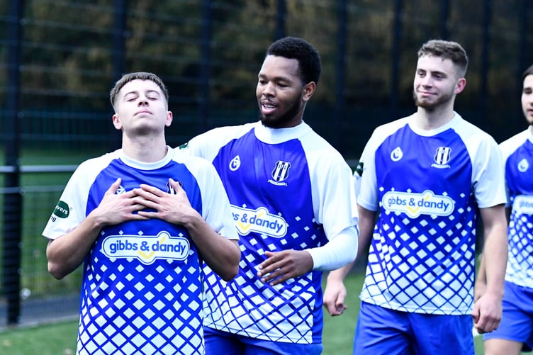 Tommy Whitby is congratulated after scoring for Sheerwater against Farnham Town at the Eastwood Centre.