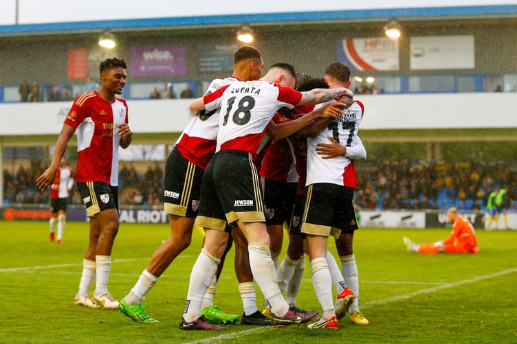 Woking celebrate going ahead at Solihull.