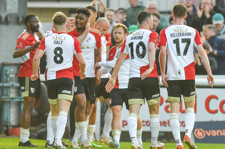 Rohan Ince is congratulated by his Woking team-mates after scoring against Bromley in the play-off match.