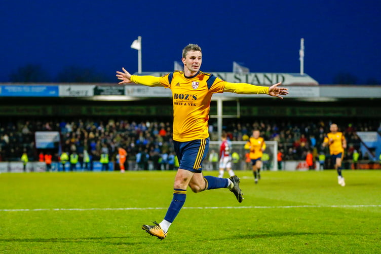 Pádraig Amond celebrates scoring for Woking.