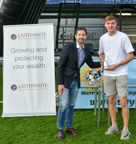 Dan Moss receives the Woking FC / News & Mail Player of the Season trophy from our sports reporter James Clark.