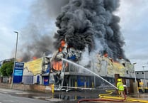 Customers asked to stay away from fire-damaged warehouse