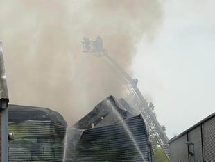 Byfleet blaze which destroyed warehouse also damaged other businesses