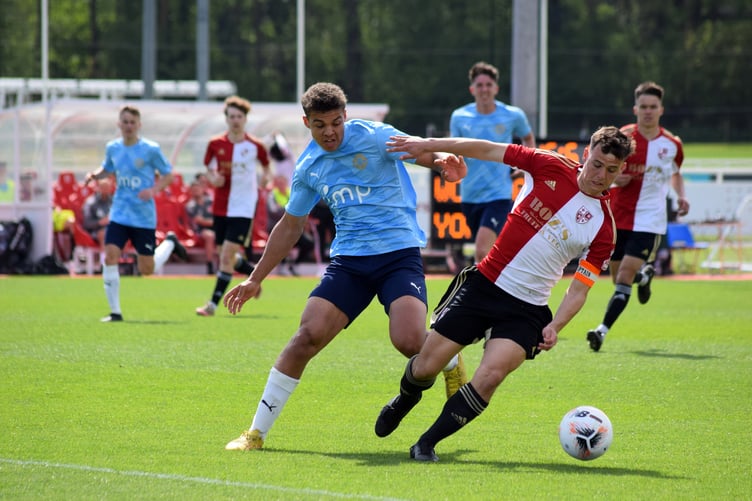 Woking Under-19s tussle with York City in the National League Academy Cup final.