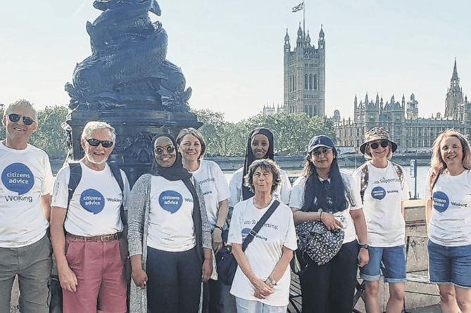 The team from Citizens Advice Woking take a breather during the London Legal Walk, the Houses of Parliament providing a stunning backdrop
