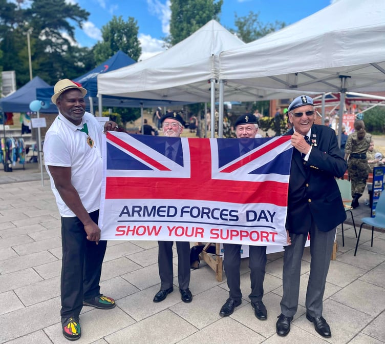 Whitehill town mayor Cllr Leeroy Scott and veterans with the Armed Forces Day flag, Café 1759, Bordon, June 24th 2023.