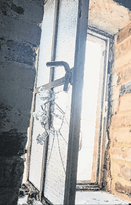 A window smashed by burglars at The Lighthouse