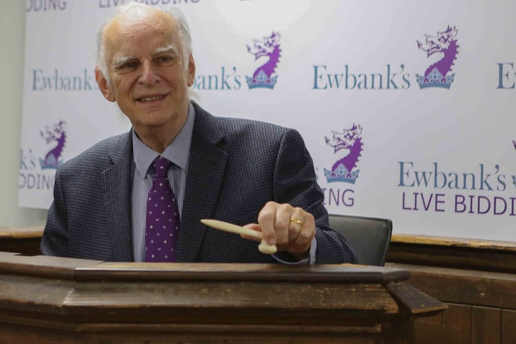 Chris Ewbank on the auction block at the company’s Burnt Common Auction Rooms in Send