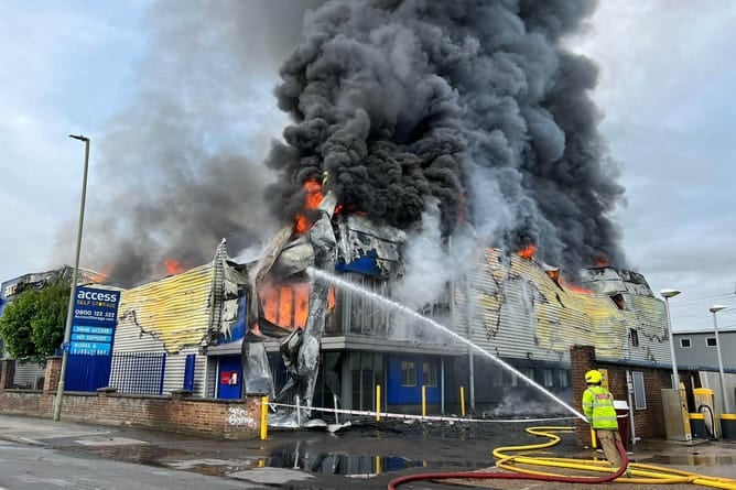 Fire crew tackle the blaze at the Access Self Storage Warehouse in Byfleet