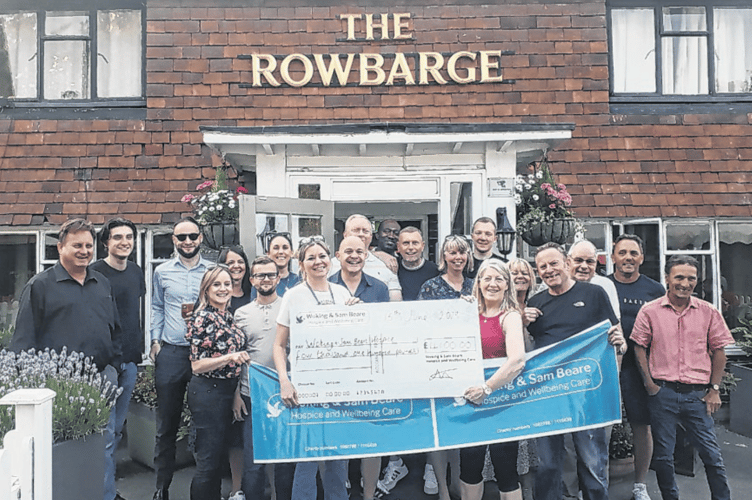 Customers of the Rowbarge pub have helped raise more than £4,000 for Woking & Sam Beare Hospice