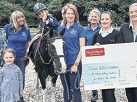 Nursery’s donation provides special saddle for therapy horse