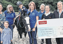 Nursery’s donation provides special saddle for therapy horse