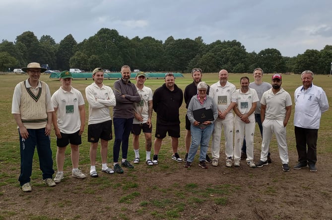 Ripley second XI and scorer Jennie Cliff. Richard Zapp is fifth right, Malcolm Burt is fourth left, James Clover is third left, Stephen Cliff is third right and Matthew Cliff is fourth right