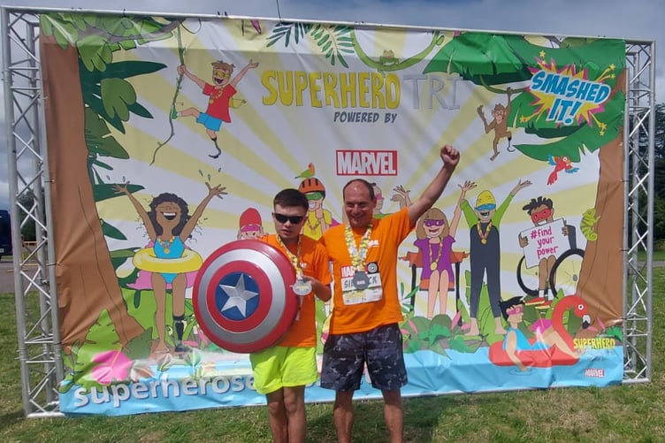 Lee Roake and his father Anthony Roake after completing Superhero Tri at Dorney Lake