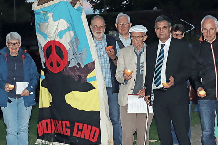 Woking Action for Peace members and friends gather on the Wey Navigation towpath at Send to commemorate the anniversary of the first use of nuclear weapons in war