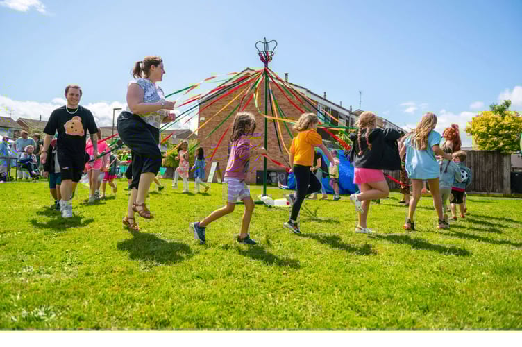 The maypole brings together the community on an occasion when audience participation was very much encouraged